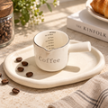 small white ceramic coffee measure cup with handle and measurement markings