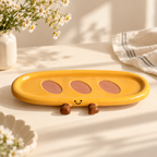 Sunny yellow ceramic snack tray with smile and sculptural brown feet