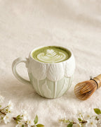 Sage green Tulip Morning Mug with matcha latte art and bamboo whisk